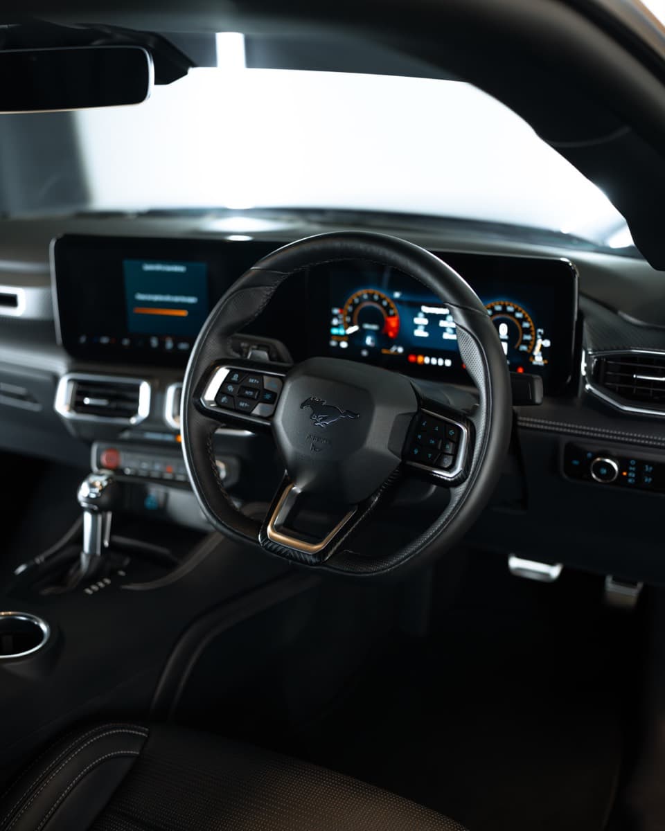 Mustang interior: steering wheel, digital dash and centre console